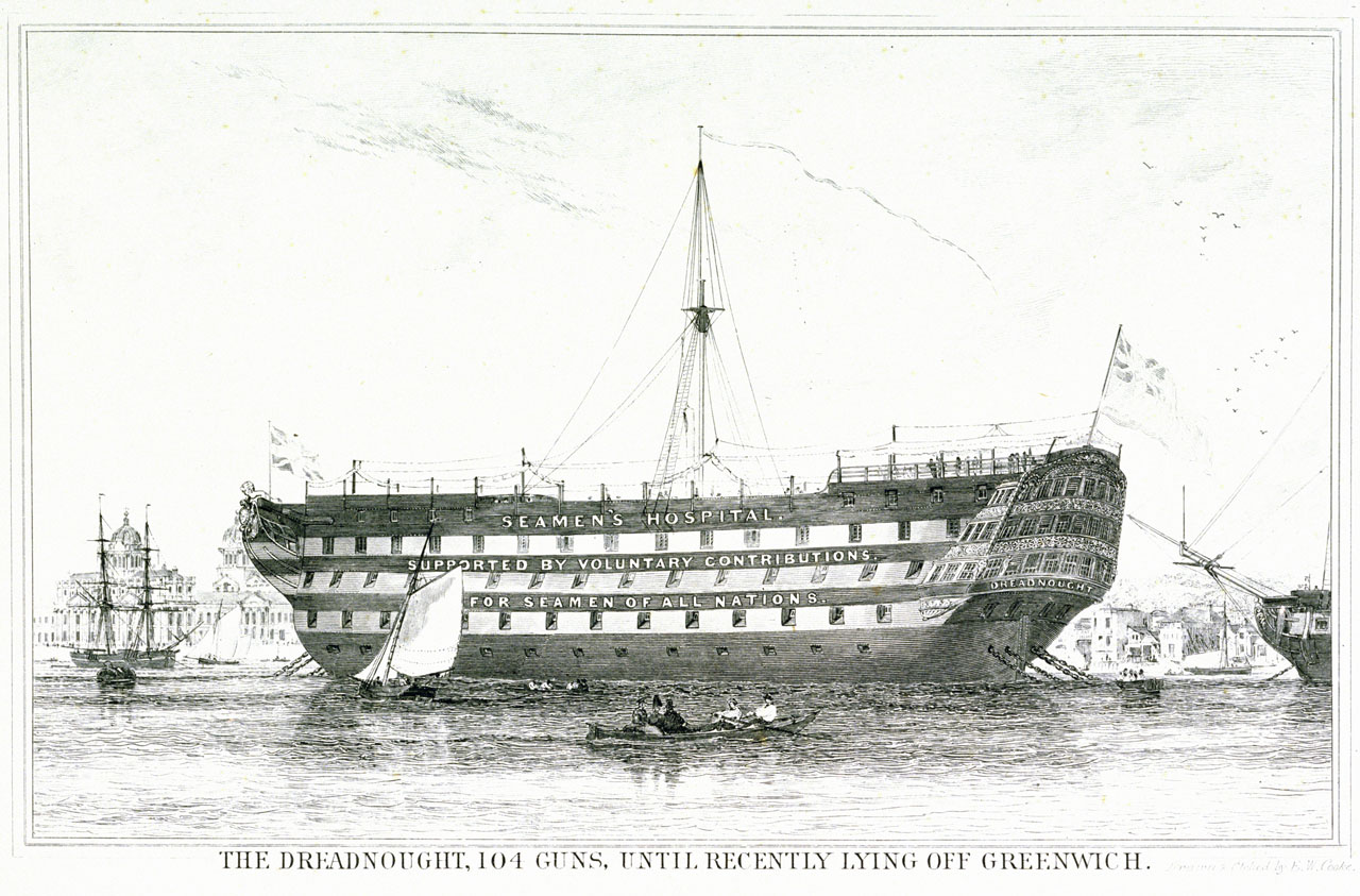 Side view of the Dreadnought Seamen's Hospital, a ship lying off Greenwich. Greenwich Hospital is visible in the background. Text on the the ship reads "Seamen's Hospital. Supported by vountary contributions. For seamen of all nations." The image is captioned "The Dreadnought. 104 Guns. Until recently lying off Greenwich."
